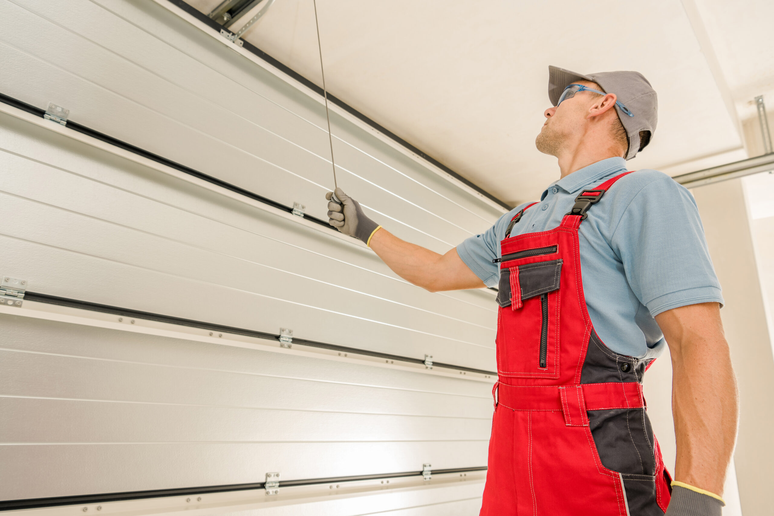 Garage Gates Maintenance Performed by Caucasian Technician